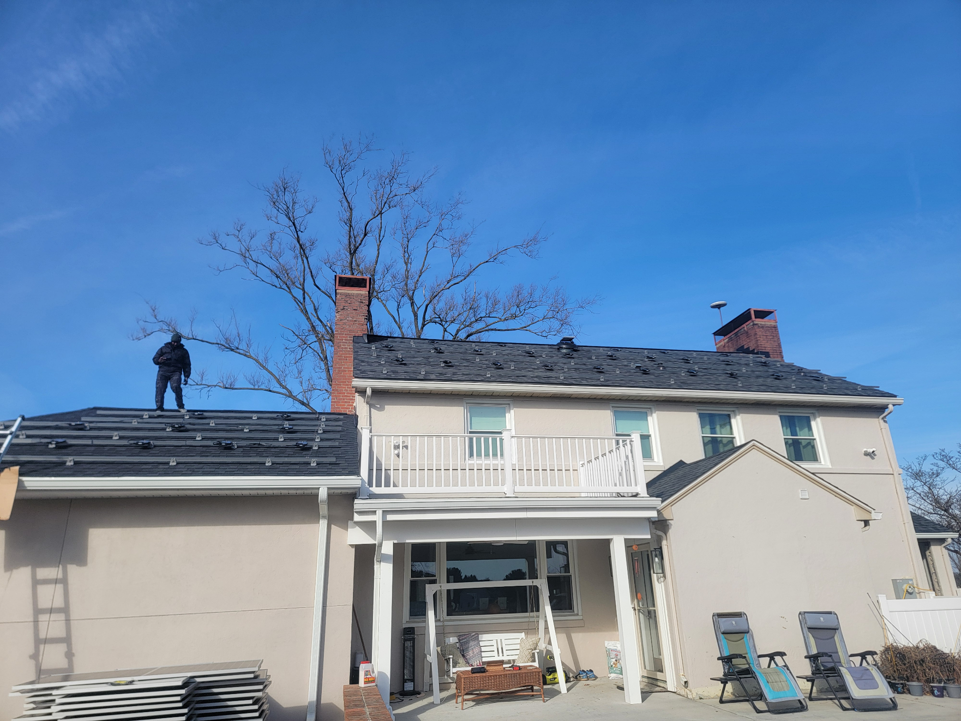 Capitol Solar Experts crew installing a rooftop solar array